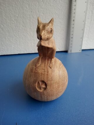 Hand-crafted Wood Squirrel on an Apple